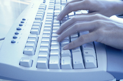 A picture of someone typing on a keyboard.