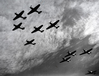 A picture of several military plans flying in formation.