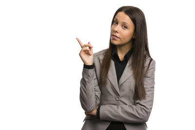 A picture of a woman pointing her finger towards the ceiling.